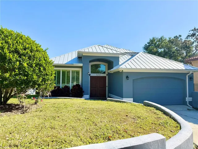 a view of a house with a small yard