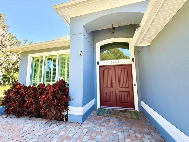 a view of entryway with flower pots