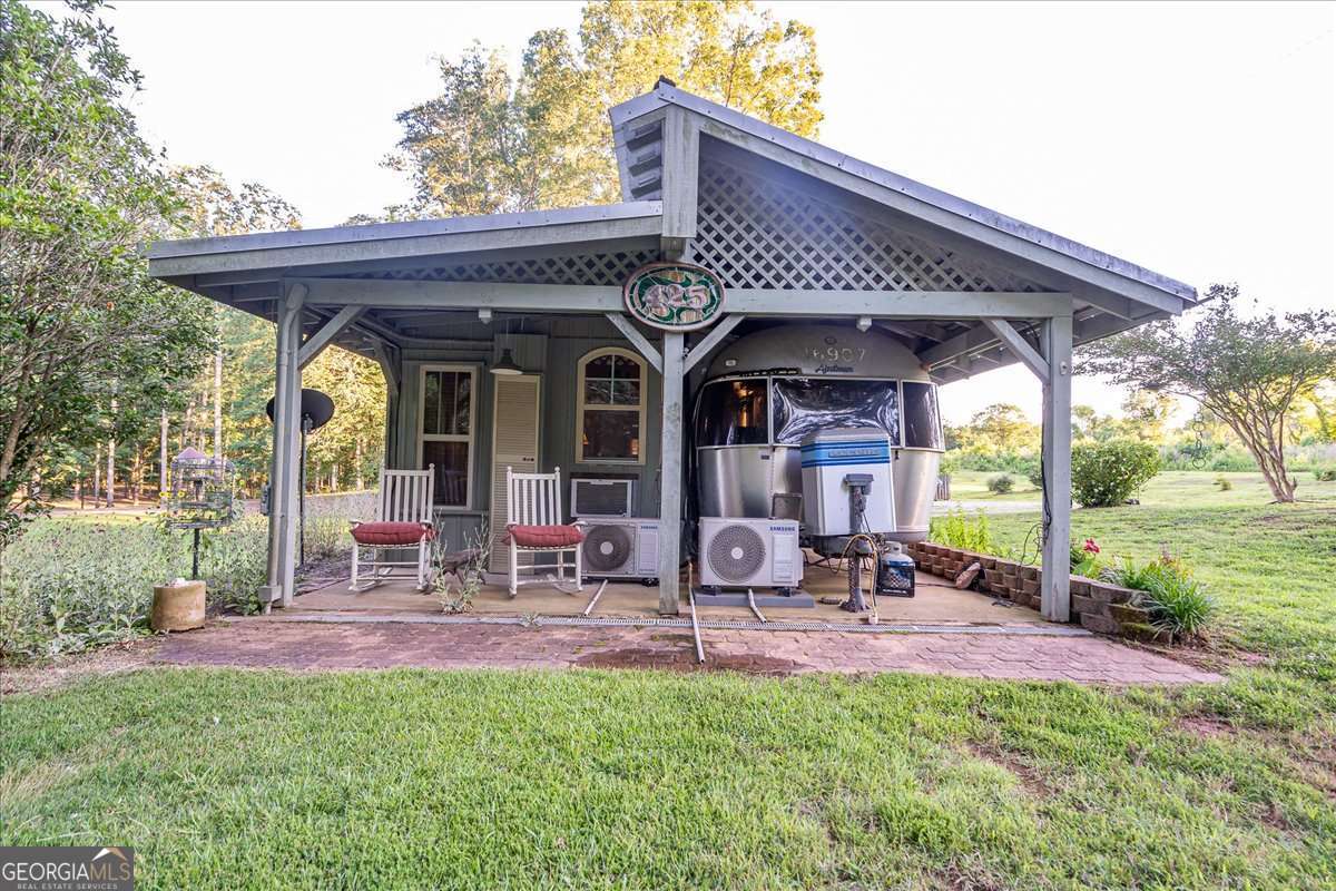 11302 Jefferson Road Athens, GA 30607 - Photo 29 of 75 a front view of house with yard and outdoor seating