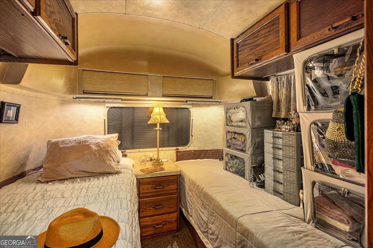 11302 Jefferson Road Athens, GA 30607 - Photo 40 of 75 a bedroom with a bed and walk in closet