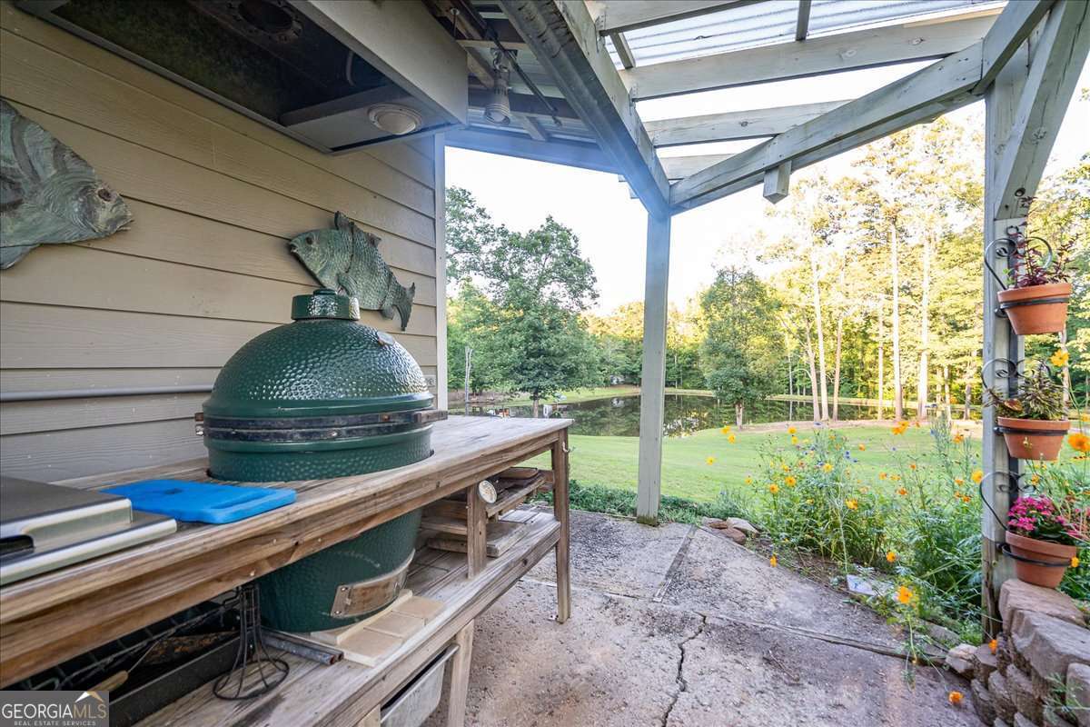11302 Jefferson Road Athens, GA 30607 - Photo 45 of 75 a view of a porch with furniture and garden