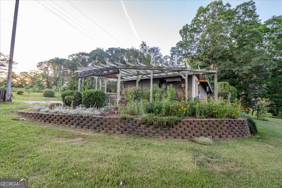 11302 Jefferson Road Athens, GA 30607 - Photo 50 of 75 a front view of a house with a garden