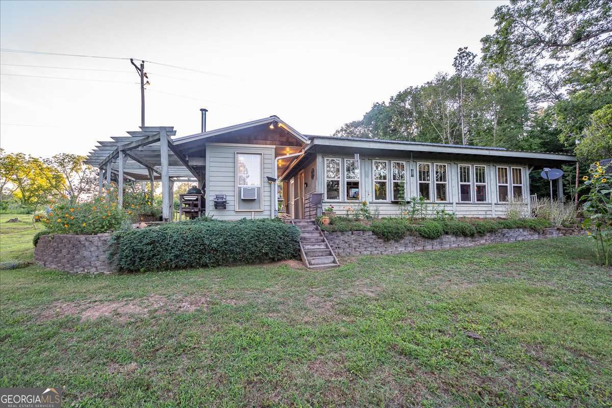 11302 Jefferson Road Athens, GA 30607 - Photo 52 of 75 a view of a house with a yard and plants