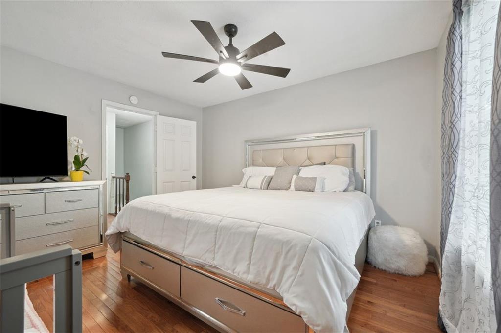 6420 Marbut Road Lithonia, GA 30058 - Photo 22 of 29 a bedroom with a bed and a flat screen tv