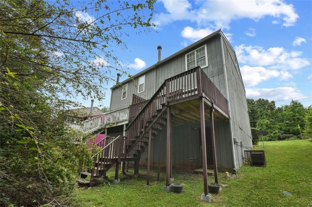 6420 Marbut Road Lithonia, GA 30058 - Photo 29 of 29 a view of a house with a yard
