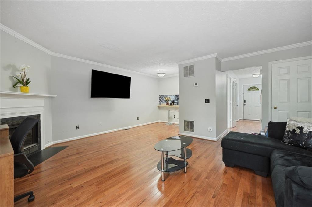 6420 Marbut Road Lithonia, GA 30058 - Photo 5 of 29 a living room with furniture and a flat screen tv