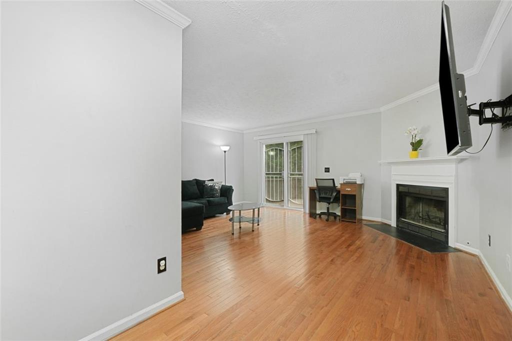 6420 Marbut Road Lithonia, GA 30058 - Photo 9 of 29 a living room with furniture and a fireplace
