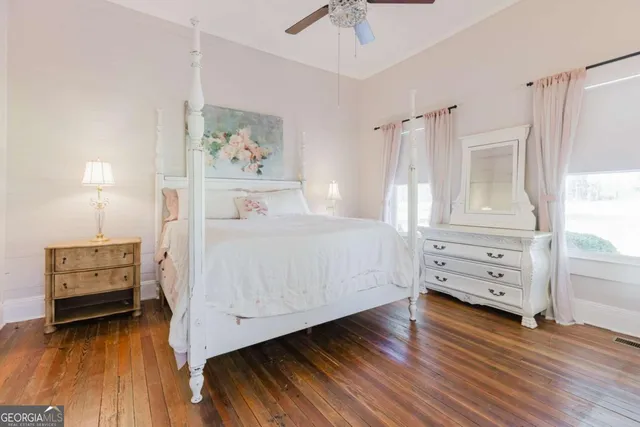 a bedroom with a bed and a fireplace