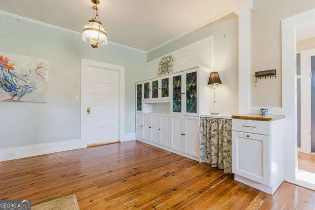 a kitchen with stainless steel appliances a refrigerator and a stove top oven