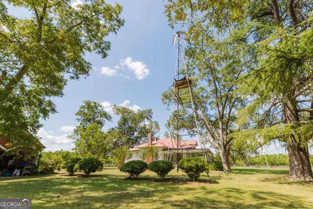 a view of a house with a yard porch and sitting area