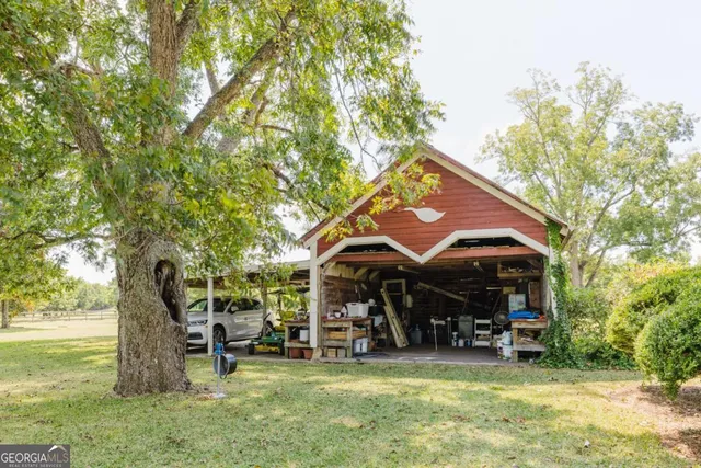 a living room with furniture and large windows