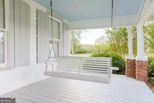 a living room with fireplace furniture and a window