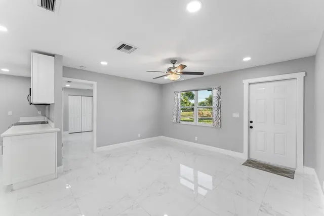 a view of an empty room with a window