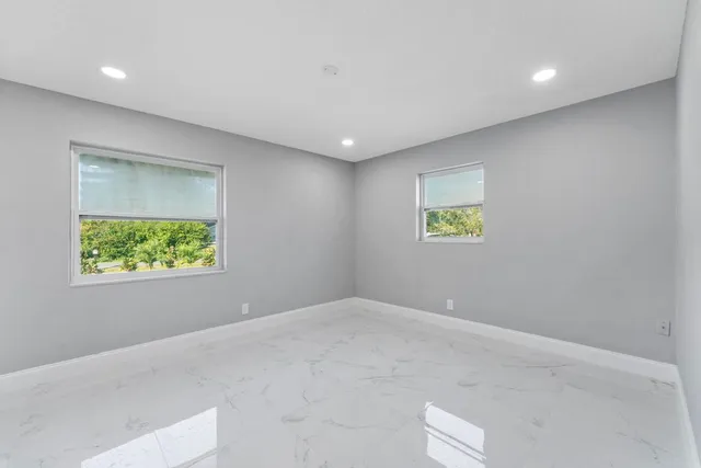 a view of an empty room with a window