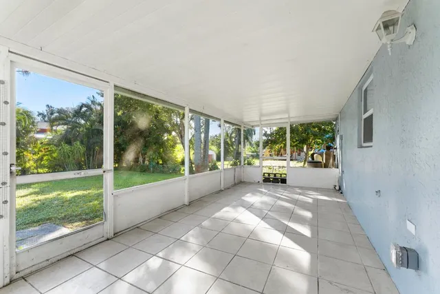 a view of a room with a large window