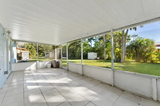 a view of a swimming pool with an outdoor seating