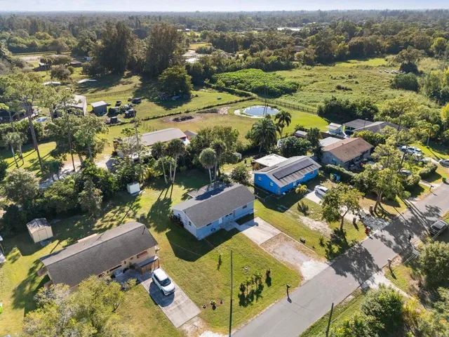 an aerial view of residential houses with outdoor space