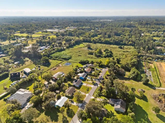 an aerial view of residential building with parking space