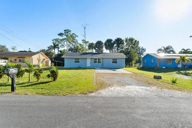a view of a house with outdoor space and sitting area