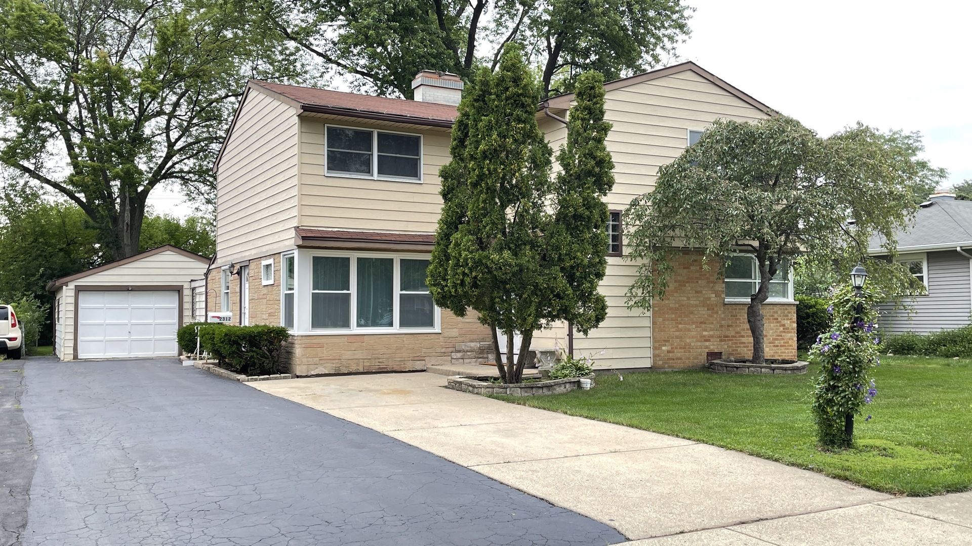 2312 Fremont Street Rolling Meadows, IL 60008 - Photo 1 of 1 a front view of a house with a yard and garage