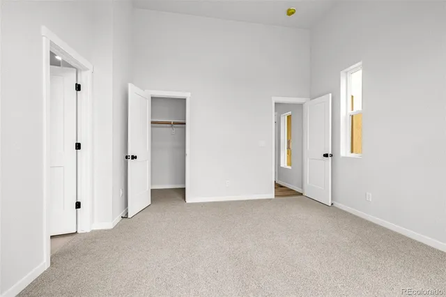 an empty room with closet area