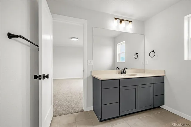 a bathroom with a double vanity sink and mirror