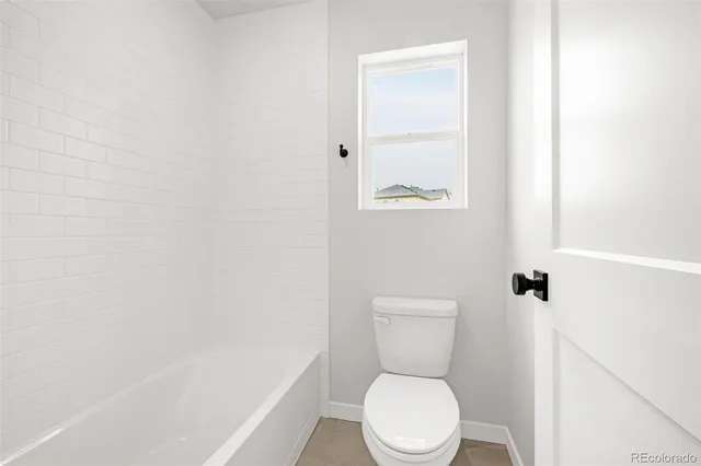 an empty room with a ceiling fan