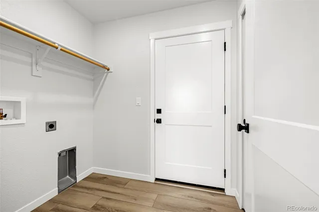 a view of a livingroom with wooden floor