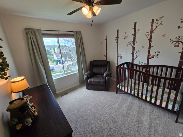 1263 Grayson Court Sandy, UT 84094 - Photo 26 of 26 bedroom with a ceiling fan and a large window