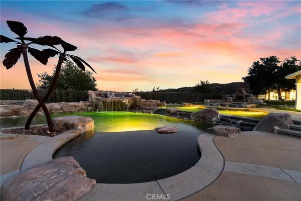 an aerial view of residential houses with outdoor space and river