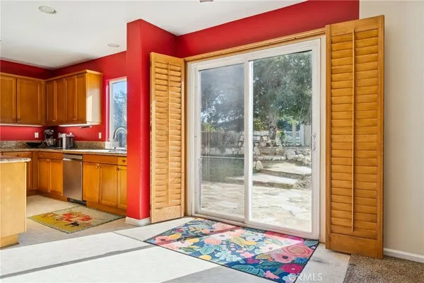 a bathroom with a sink a mirror a toilet and shower