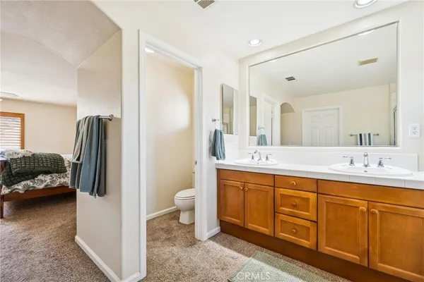 a view of an empty room with a kitchen