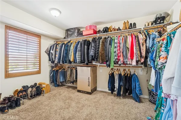 a view of a kitchen with furniture and a ceiling fan