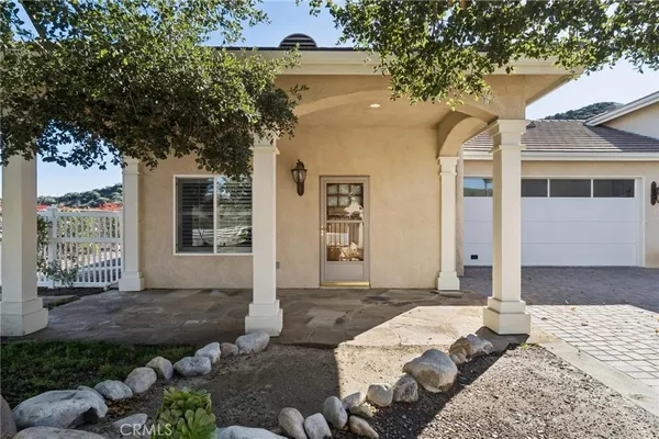 a view of a swimming pool with a yard