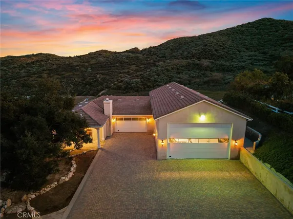 a view of a lake with a houses in the back