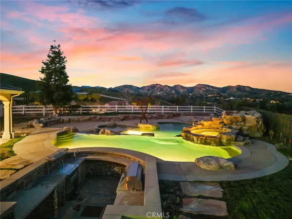 a view of a house with truck parked