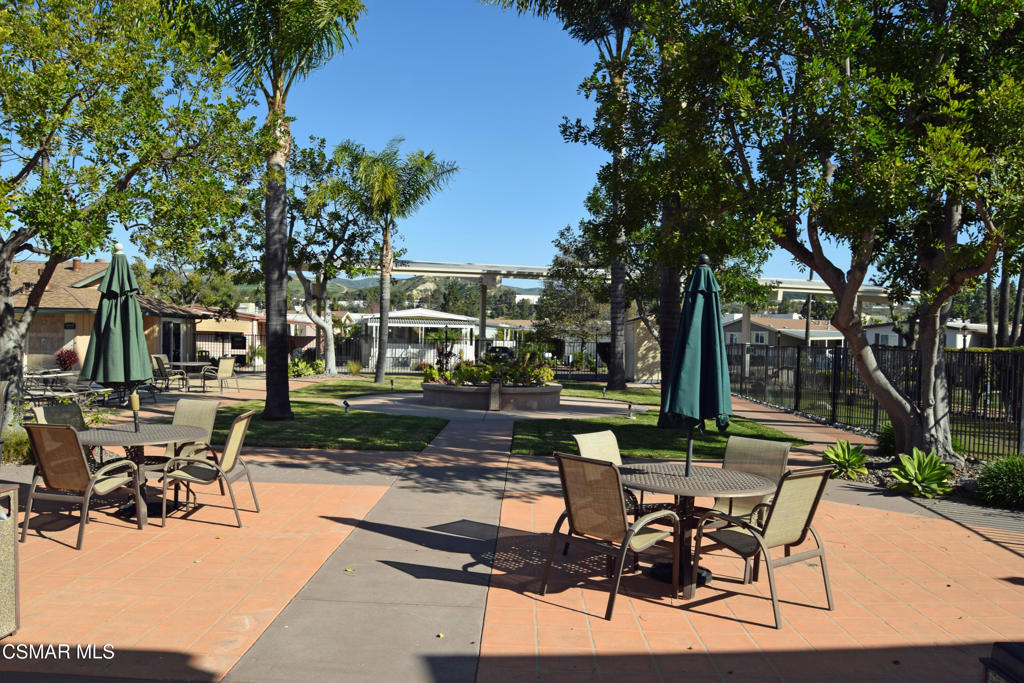195 Tierra Rejada Road, Unit 197 Simi Valley, CA 93065 - Photo 23 of 28 a view of a backyard with sitting area