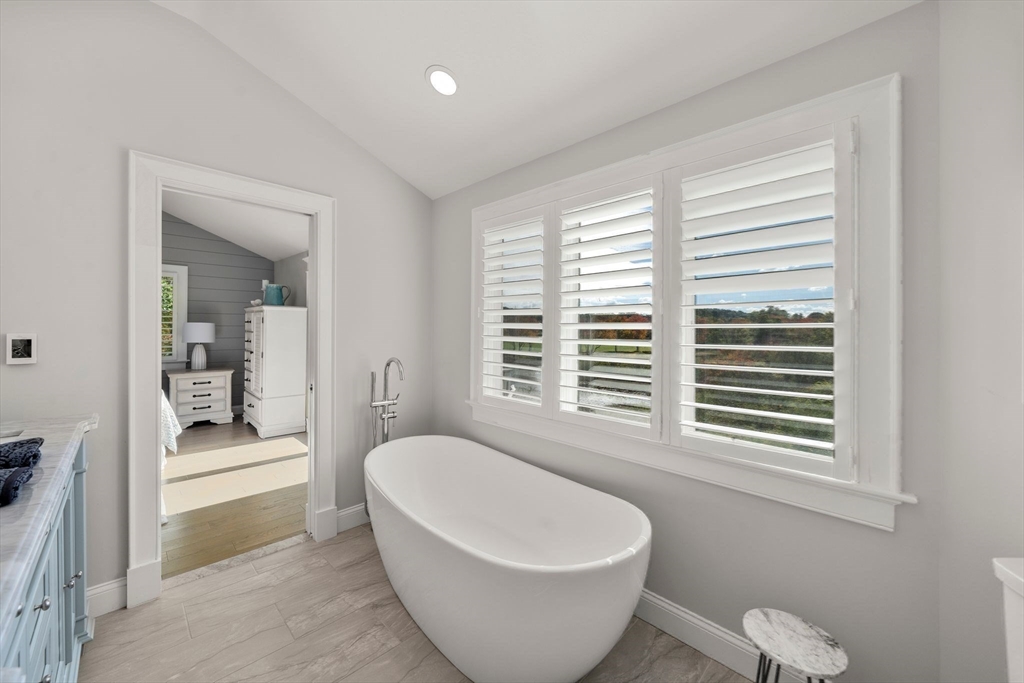 122 Clifford Road Plymouth, MA 02360 - Photo 27 of 38 a spacious bathroom with a bathtub and window