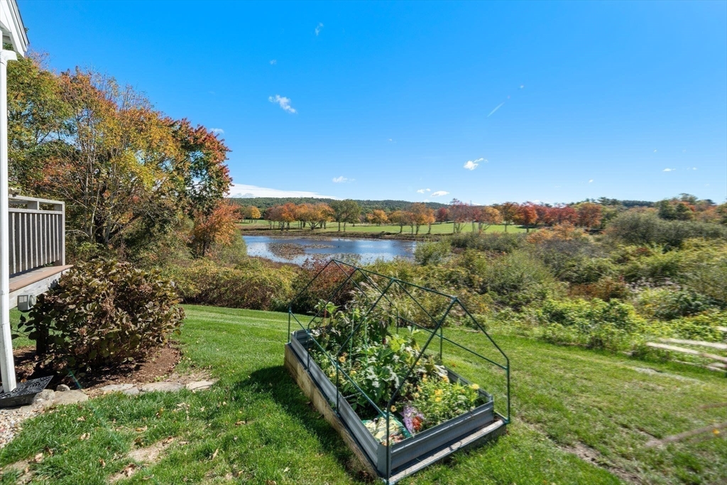 122 Clifford Road Plymouth, MA 02360 - Photo 35 of 38 a view of a garden with plants and a lake view