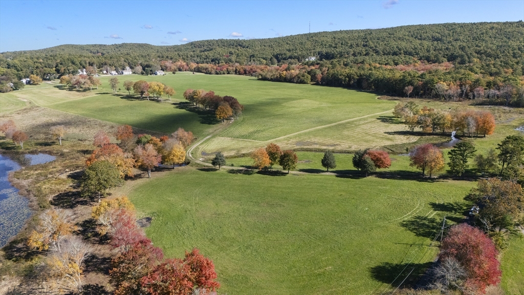 122 Clifford Road Plymouth, MA 02360 - Photo 4 of 38 a view of a field with a mountain in the background
