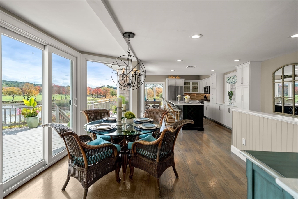 122 Clifford Road Plymouth, MA 02360 - Photo 8 of 38 a dining room with furniture a chandelier and wooden floor