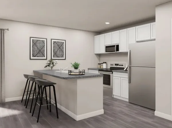 a kitchen with kitchen island white cabinets and refrigerator