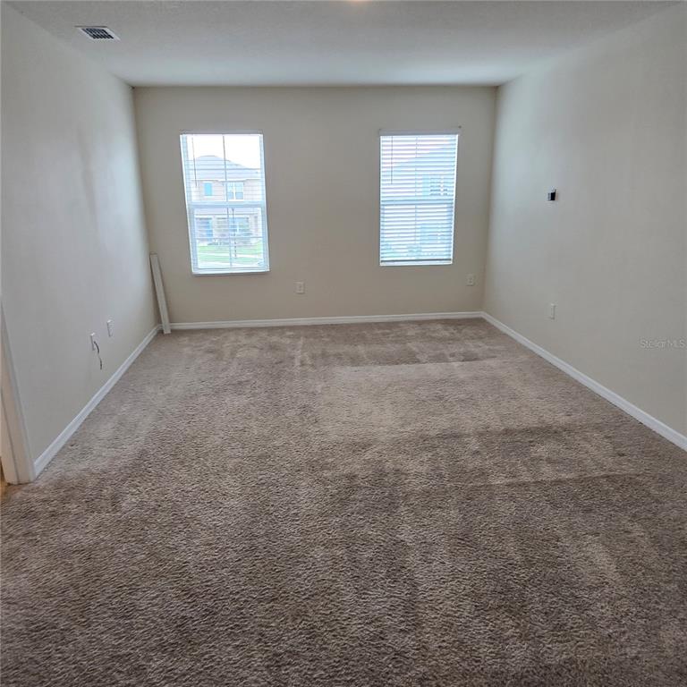 814 Sun Burst Road Winter Haven, FL 33880 - Photo 41 of 48 an empty room with windows