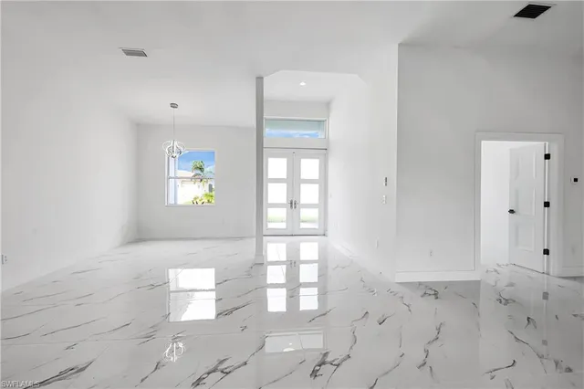 a view of empty room with windows