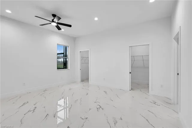 a view of empty room with windows