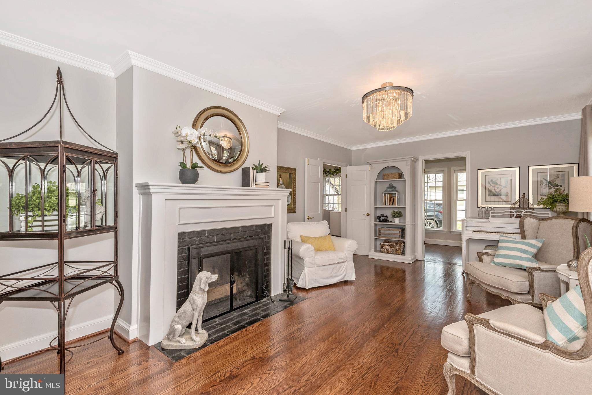 Living Room w/Wood Burning Fireplace and Built-ins