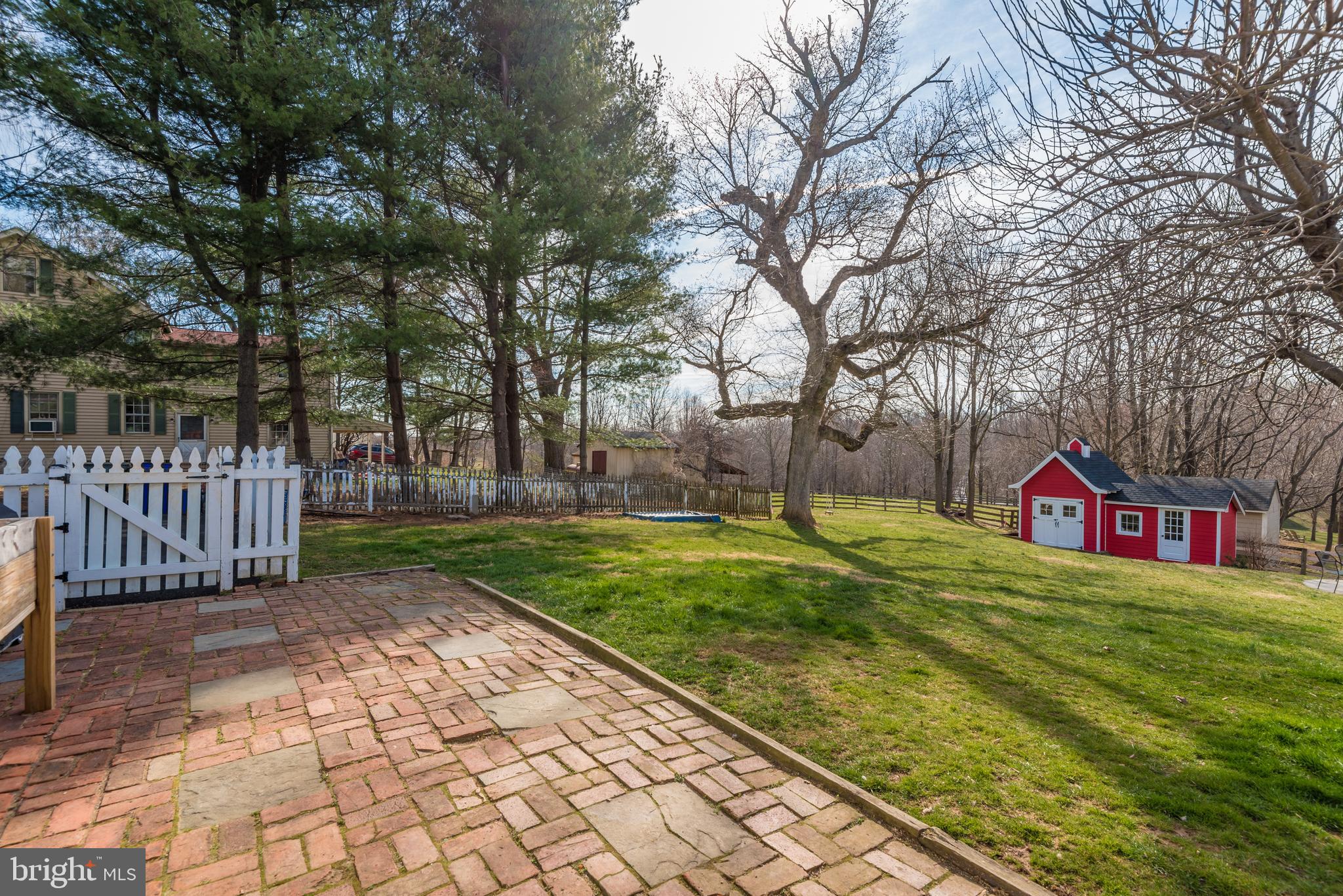 13904 Darnestown Road Gaithersburg, MD 20878 - Photo 39 of 42 Paver Patio and Large Backyard