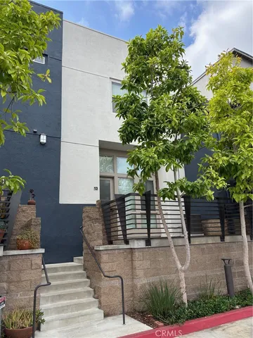 a front view of a house with trees