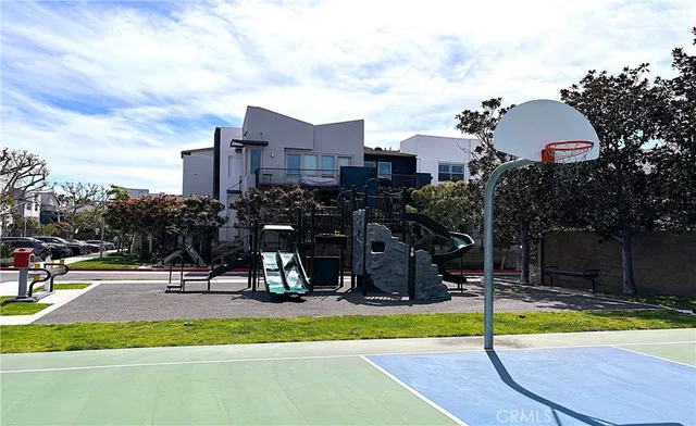 a view of a park with swings and slides