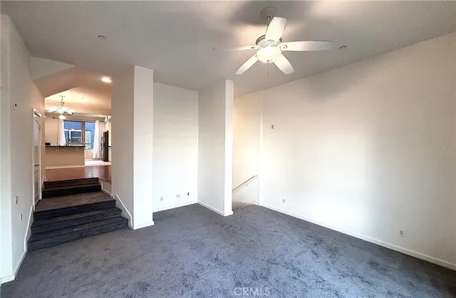 wooden floor in an empty room and a chandelier fan fire place